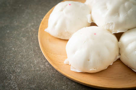 stuffed steamed bun on wood plate - Chinese food styleの写真素材