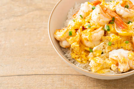 homemade creamy omelet with shrimps rice bowlの写真素材