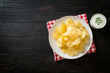 potato chips with sour cream dipping sauceの写真素材