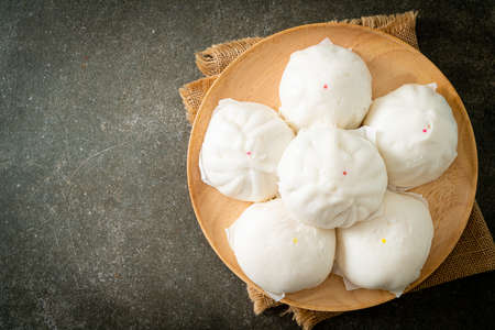 stuffed steamed bun on wood plate - Chinese food styleの写真素材