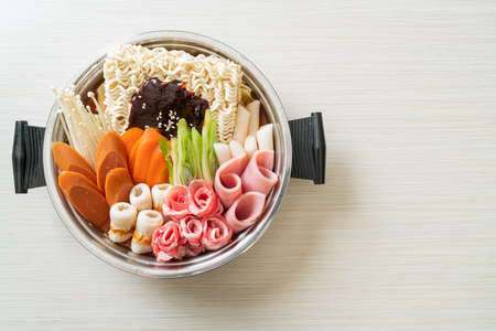 Budae Jjigae or Budaejjigae (Army stew or Army base stew). It is loaded with Kimchi, spam, sausages, ramen noodles and much more - popular Korean hot pot food styleの写真素材