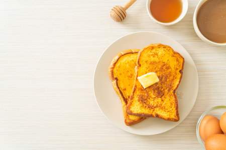 French toasted with butter and honey for breakfast