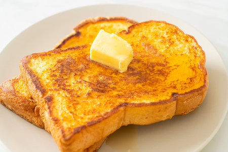 French toasted with butter and honey for breakfastの写真素材