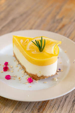 lemon cheese cake on plate in cafe and restaurant