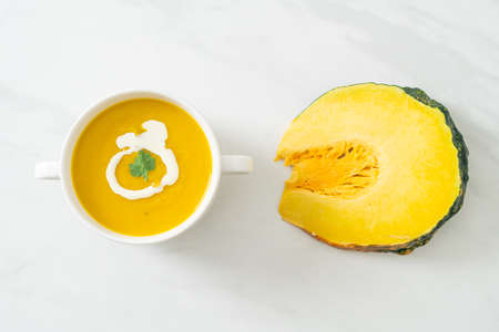 pumpkin soup in white bowl - Vegetarian and vegan food styleの写真素材