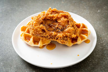 homemade fried chicken waffle with honey or maple syrupの写真素材