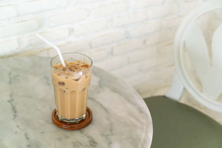 iced latte coffee glass on table in coffee shop cafeの写真素材
