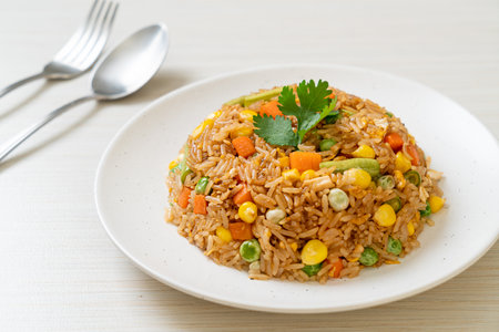 fried rice with green peas, carrot and corn - vegetarian and healthy food styleの写真素材