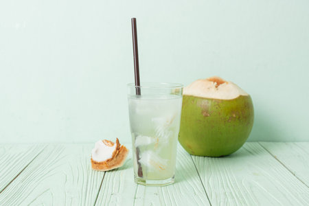 coconut water or coconut juice in glas with ice cubeの写真素材