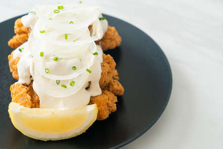 Snow Onion Chicken or Fried Chicken with Creamy Onions Sauce with Lemon in Korean style - Korean food styleの写真素材