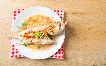 Steamed grouper fish with lime and chillies - Asian food style