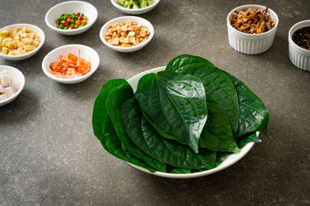 Miang kham - A royal leaf wrap appetizer - It is a traditional Southeast Asian snack from Thailand and Laos.の写真素材