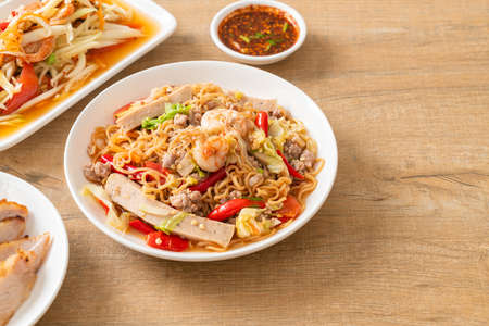 Instant noodles spicy salad on plate in Asian style - Thai food style