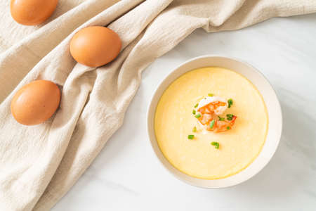 Steamed egg with shrimp and spring onions on topの写真素材