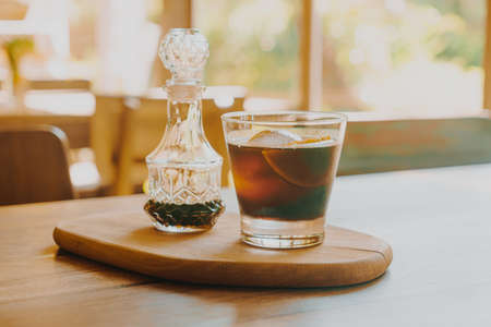 iced cold brew coffee on wood tray - soft focus pointの写真素材