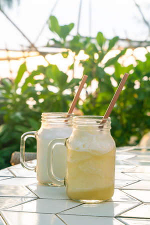 Pineapple Smoothie Jar on table- healthy drinkの写真素材