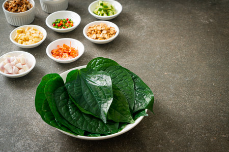 Miang kham - A royal leaf wrap appetizer - It is a traditional Southeast Asian snack from Thailand and Laos.の写真素材