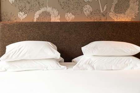 white pillow decoration on bed in bedroom
