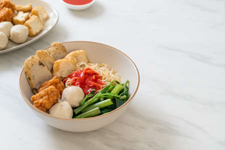 egg noodles with fish balls and shrimp balls in pink sauce, Yen Ta Four or Yen Ta Fo - Asian food styleの写真素材