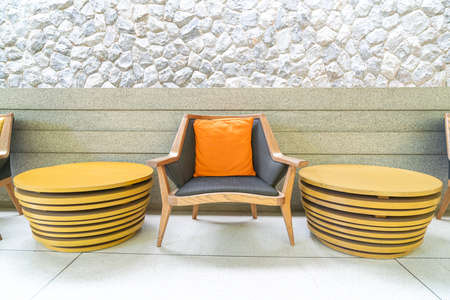 empty outdoor patio chair with pillow on balconyの写真素材