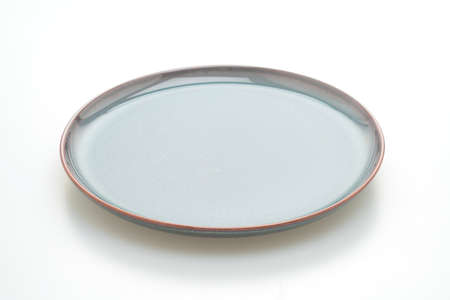empty beautiful and vintage  ceramic plate isolated on white backgroundの写真素材