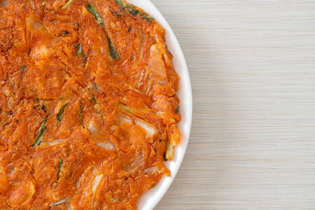 Korean Kimchi pancake or Kimchijeon - Fried Mixed Egg, Kimchi, and Flour - Korean food styleの写真素材