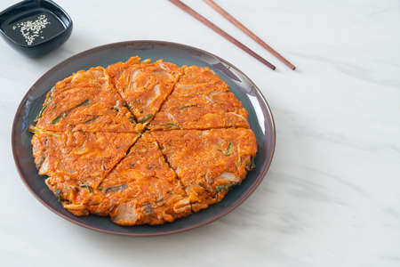 Korean Kimchi pancake or Kimchijeon - Fried Mixed Egg, Kimchi, and Flour - Korean food styleの写真素材