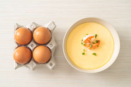 Steamed egg with shrimp and spring onions on top