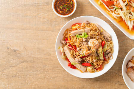 Instant noodles spicy salad on plate in Asian style - Thai food styleの写真素材
