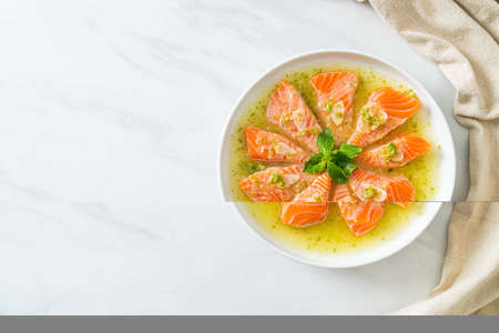 Spicy Fresh Salmon Raw in Seafood Salad Sauceの写真素材