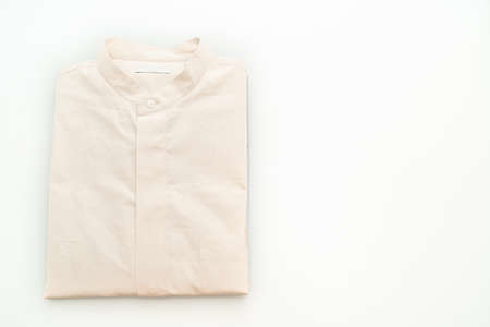 beige shirt fold isolated on white backgroundの写真素材