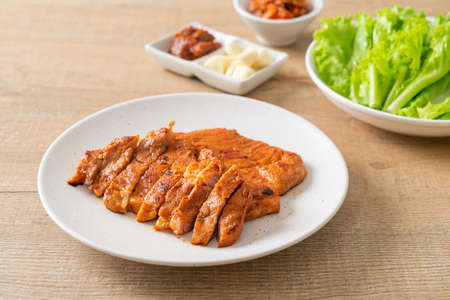 grilled pork marinated Kochujang sauce in Korean style with vegetable and kimchi - Korean food styleの写真素材