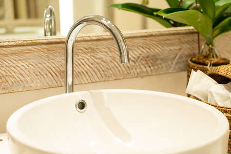 close-up water faucet in bathroom
