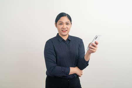 Asian woman using smartphone or mobile phone on white backgroundの写真素材