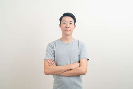 portrait happy young Asian man smiling on white backgroundの写真素材