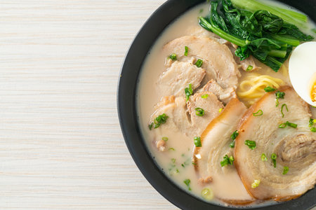 Ramen noodles in pork bone soup with roast pork and egg or Tonkotsu ramen noodles - Japanese food styleの写真素材