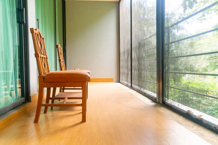 empty vintage wood chair on balconyの写真素材