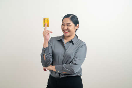 portrait Asian woman holding credit card with white backgroundの写真素材