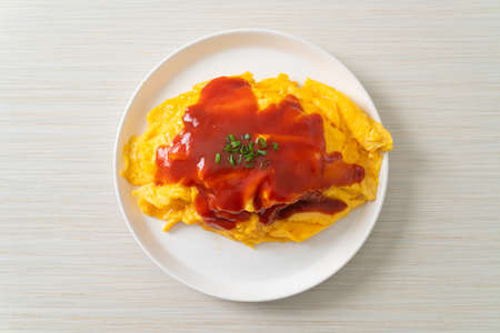 Flavored Fried Rice in an Omelet Wrapping or Omurice in Japanese style - Asian food styleの写真素材