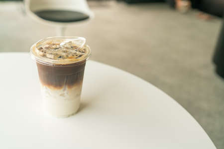 iced latte coffee cup on table in cafe coffee shopの写真素材