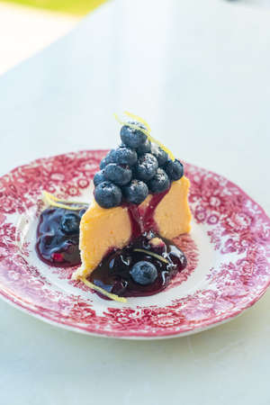 blueberry cheese cake on vintage porcelain plate