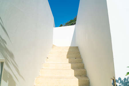 stair step with white wall and blue skyの写真素材