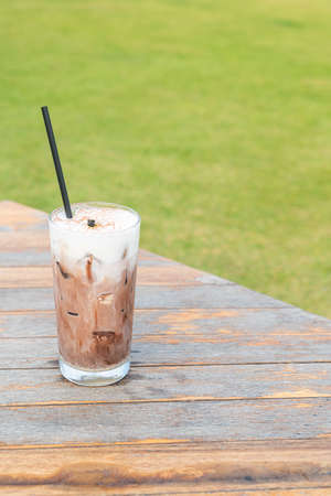 ice chocolate milkshake on wood tableの写真素材