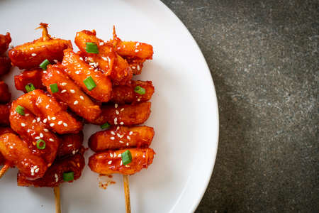 deep fried Korean rice cake (Tteokbokki) skewered with spicy sauce - Korean food styleの写真素材