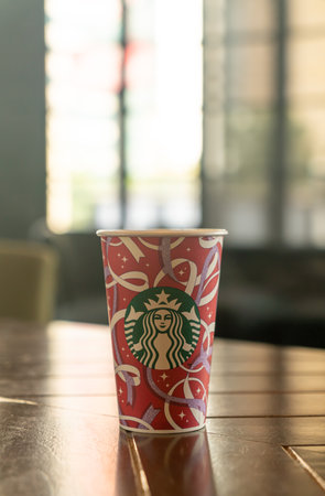 BANGKOK, THAILAND - Nov 24, 2021: Starbucks hot beverage coffee with Christmas theme on the table in Starbuck coffee shop.のeditorial素材