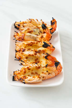 grilled river prawns or shrimps with cheese - seafood styleの写真素材