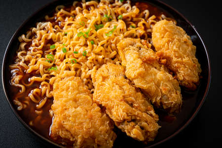 Korean instant noodles with fried chicken or Fried chicken ramyeon - Korean food style