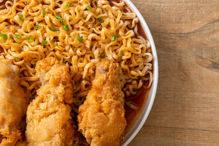 Korean instant noodles with fried chicken or Fried chicken ramyeon - Korean food styleの写真素材