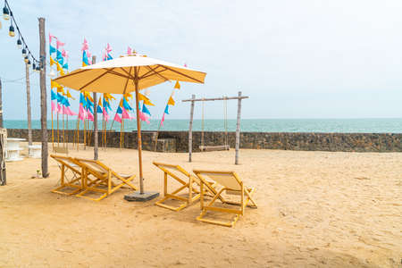 empty beach chair on beach with sea backgroundの写真素材