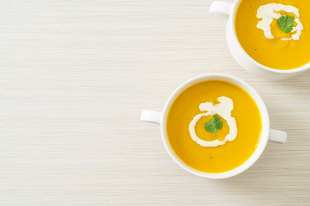 pumpkin soup in white bowl - Vegetarian and vegan food styleの写真素材